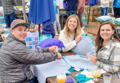 HandsOn San Diego volunteers make pillows at VolunBeers