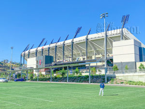 Snapdragon Stadium luxury grass-covered tailgate parking lot in San Diego.